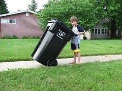 kid taking out trash