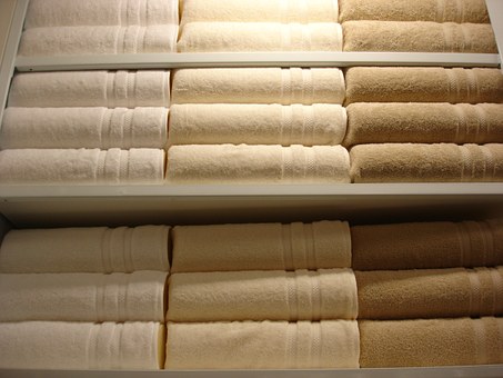 bath towels folded and on shelves