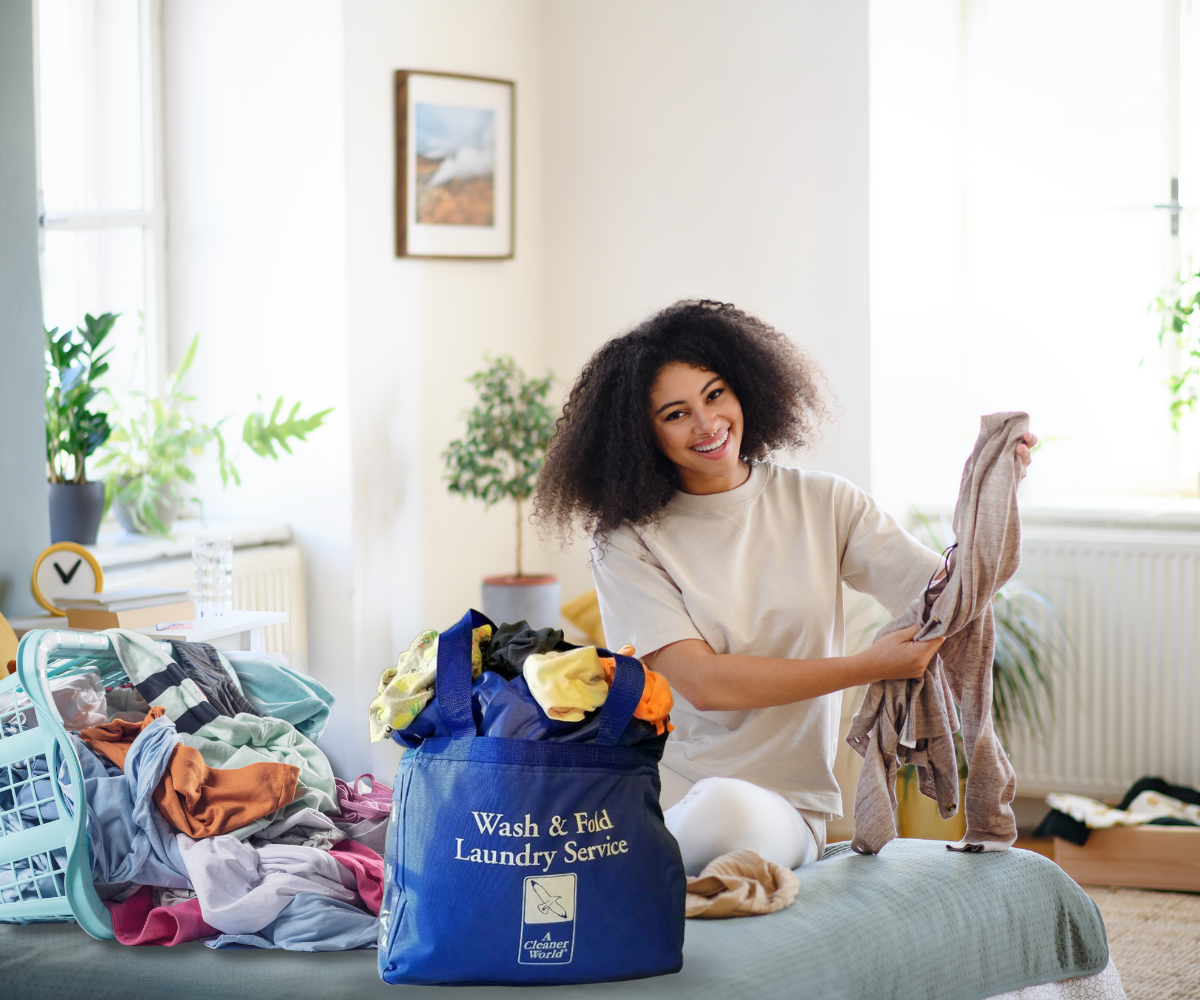 College student sorting laundry in dorm room